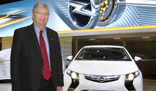 Nick Reilly standing next to an Opel Ampera