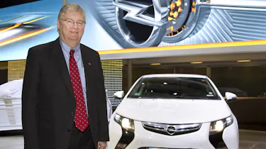Nick Reilly standing next to an Opel Ampera