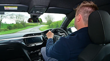 Auto Express senior news reporter Alastair Crooks driving the Vauxhall Corsa GS