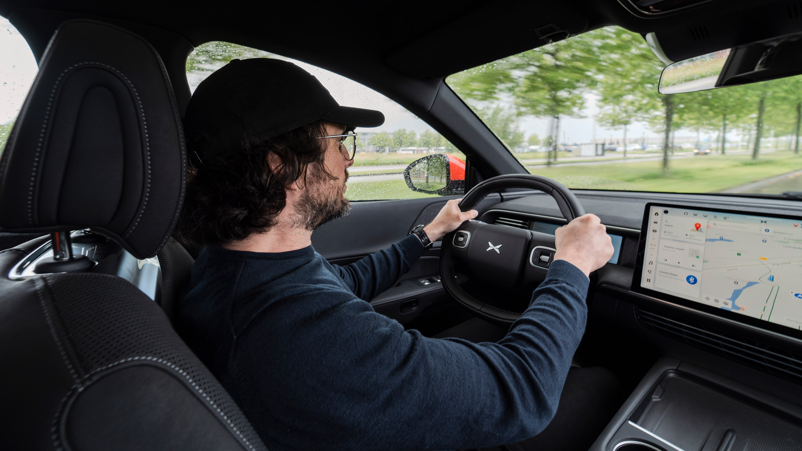 John Mahoney driving the XPeng G6