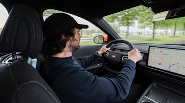 John Mahoney driving the XPeng G6