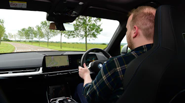 Auto Express news reporter Ellis Hyde driving the BMW iX1