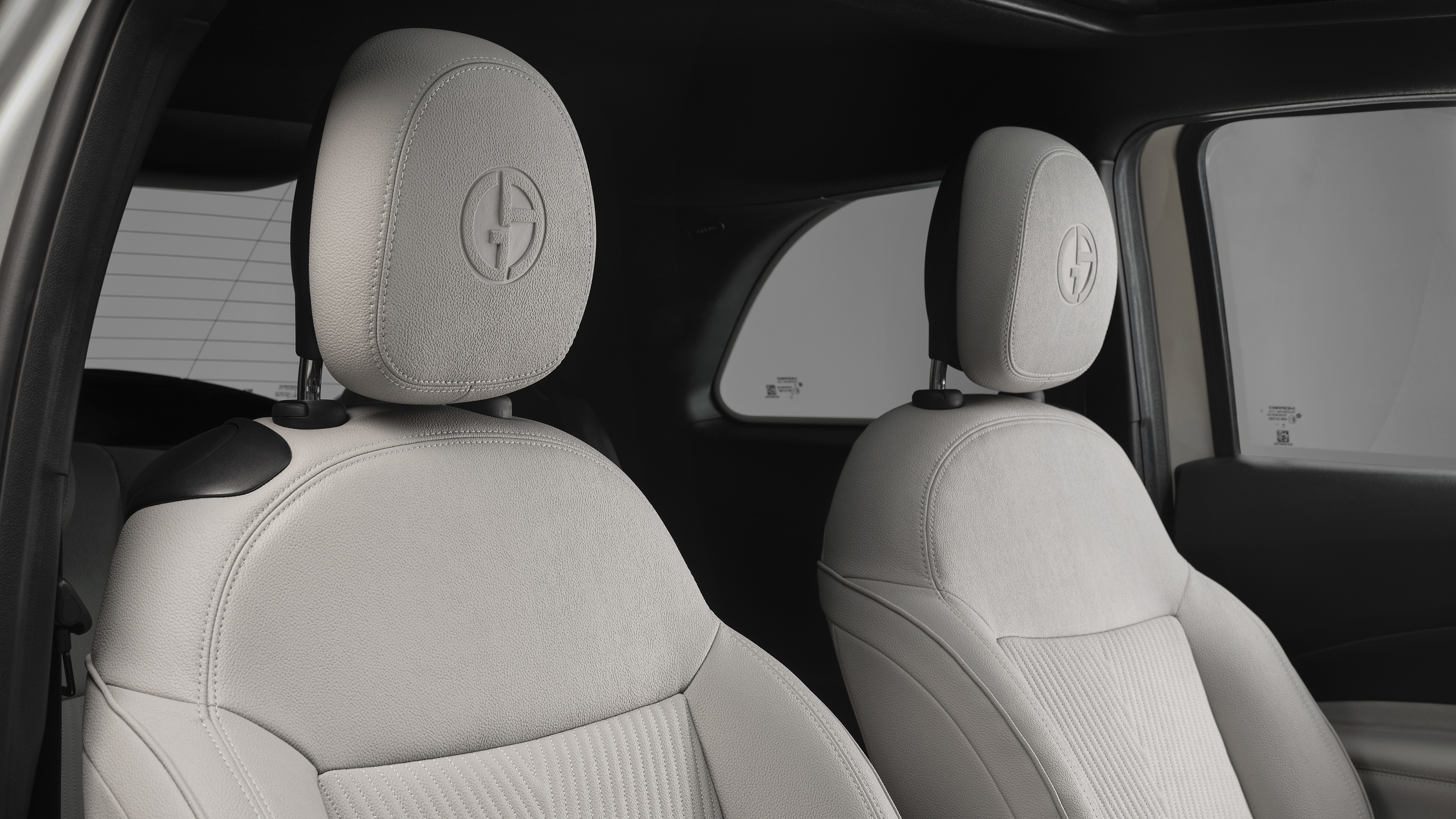 Fiat 500e Giorgio Armani - front seats with Armani logo embossed into headrest 