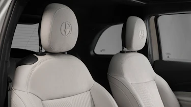 Fiat 500e Giorgio Armani - front seats with Armani logo embossed into headrest