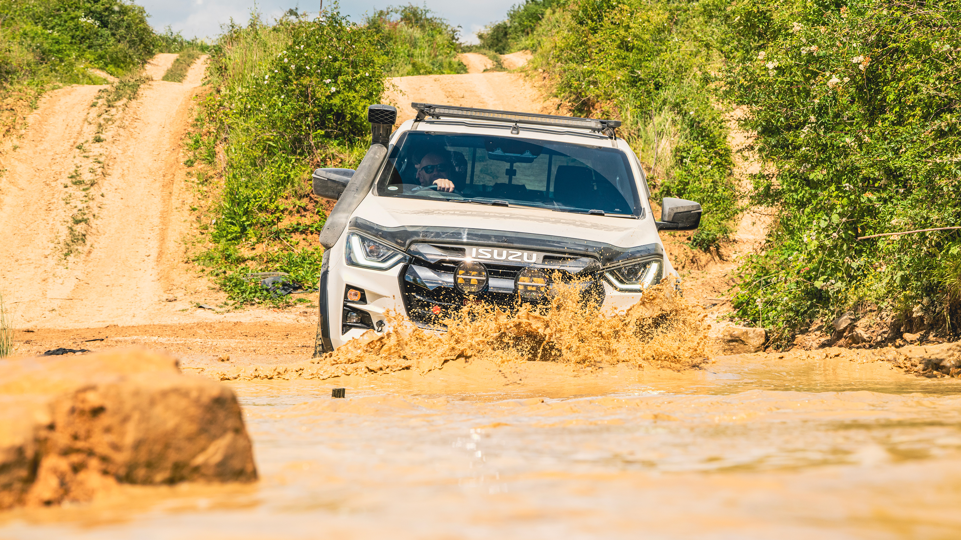 Isuzu D-Max Mudmaster - driving through muddy water (front)
