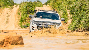 Isuzu D-Max Mudmaster - driving through muddy water (front)