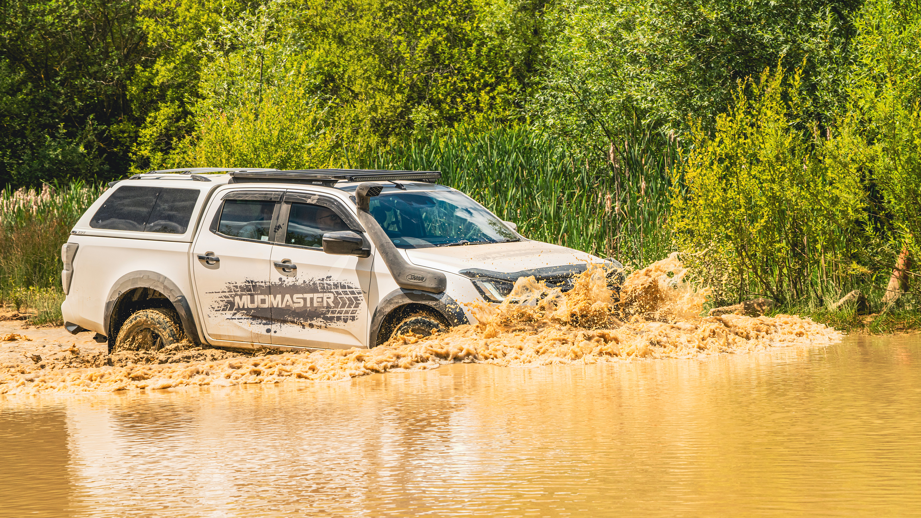 Isuzu D-Max Mudmaster - driving through muddy water (front 3/4)