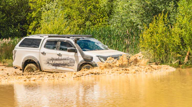 Isuzu D-Max Mudmaster - driving through muddy water (front 3/4)