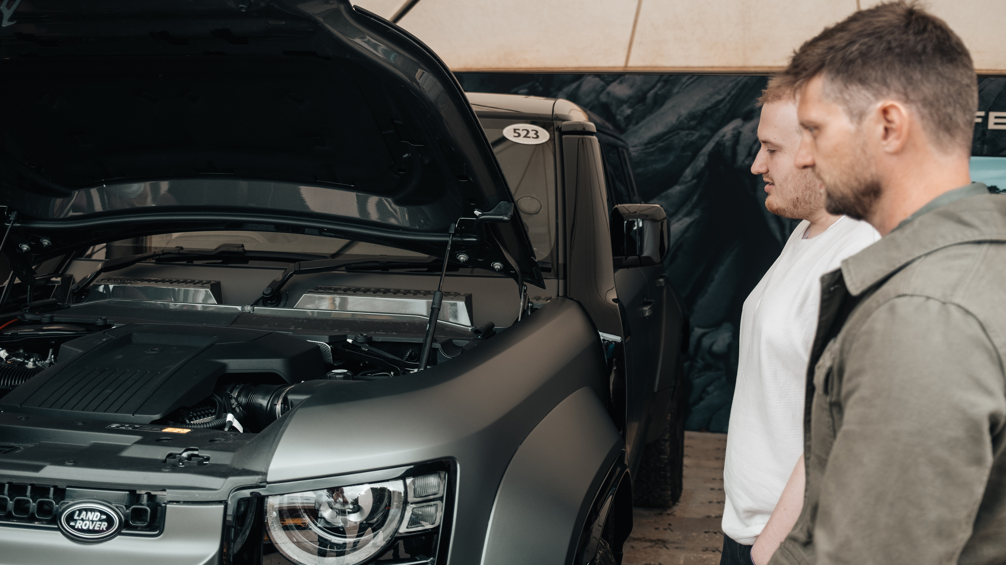 Auto Express news reporter Ellis Hyde and Shaun Birch looking at the Land Rover Defender OCTA's engine bay