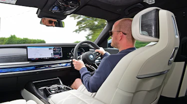Alex Ingram driving the BMW i7