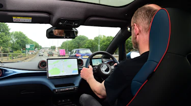 BYD Dolphin interior shot, car being driven by Auto Express chief sub-editor Andy Pringle