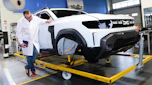 John McIlroy inspecting a Dacia Duster bodyshell