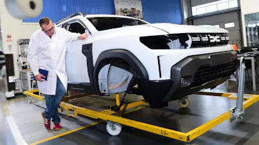 John McIlroy inspecting a Dacia Duster bodyshell
