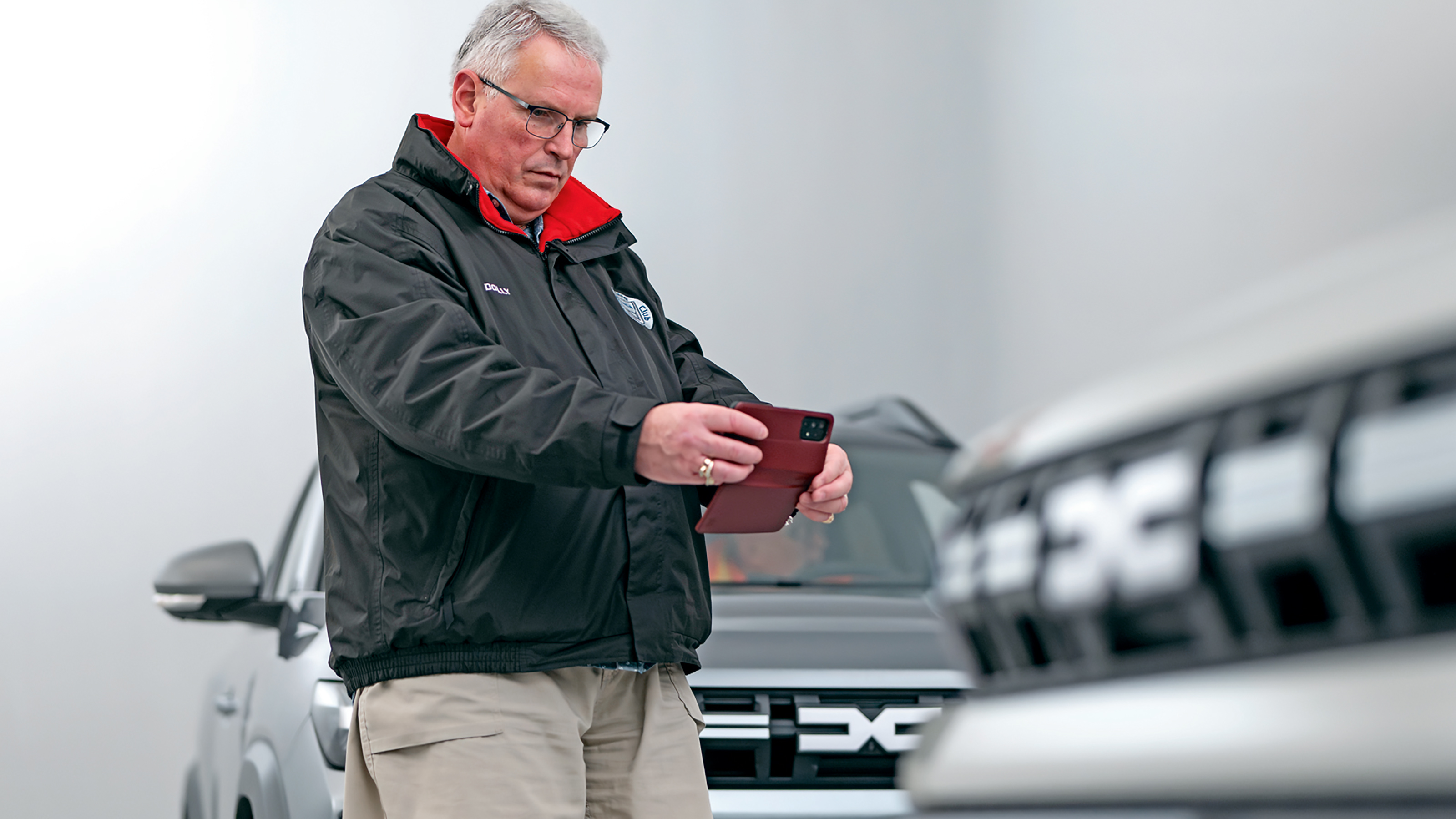 Dacia owner taking a photo of the Dacia Duster's grille