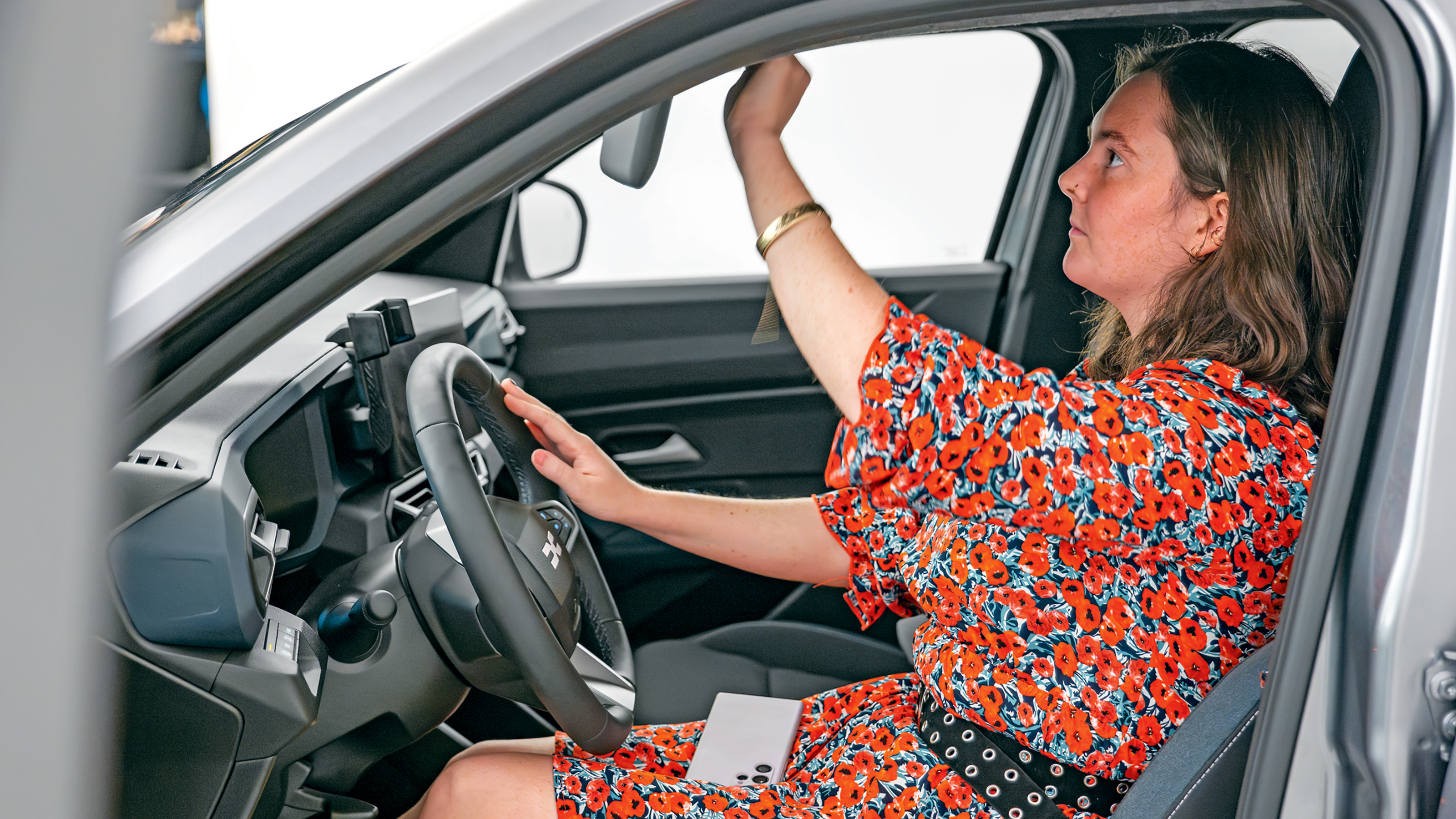 Dacia owner taking a inspecting the Dacia Duster's interior