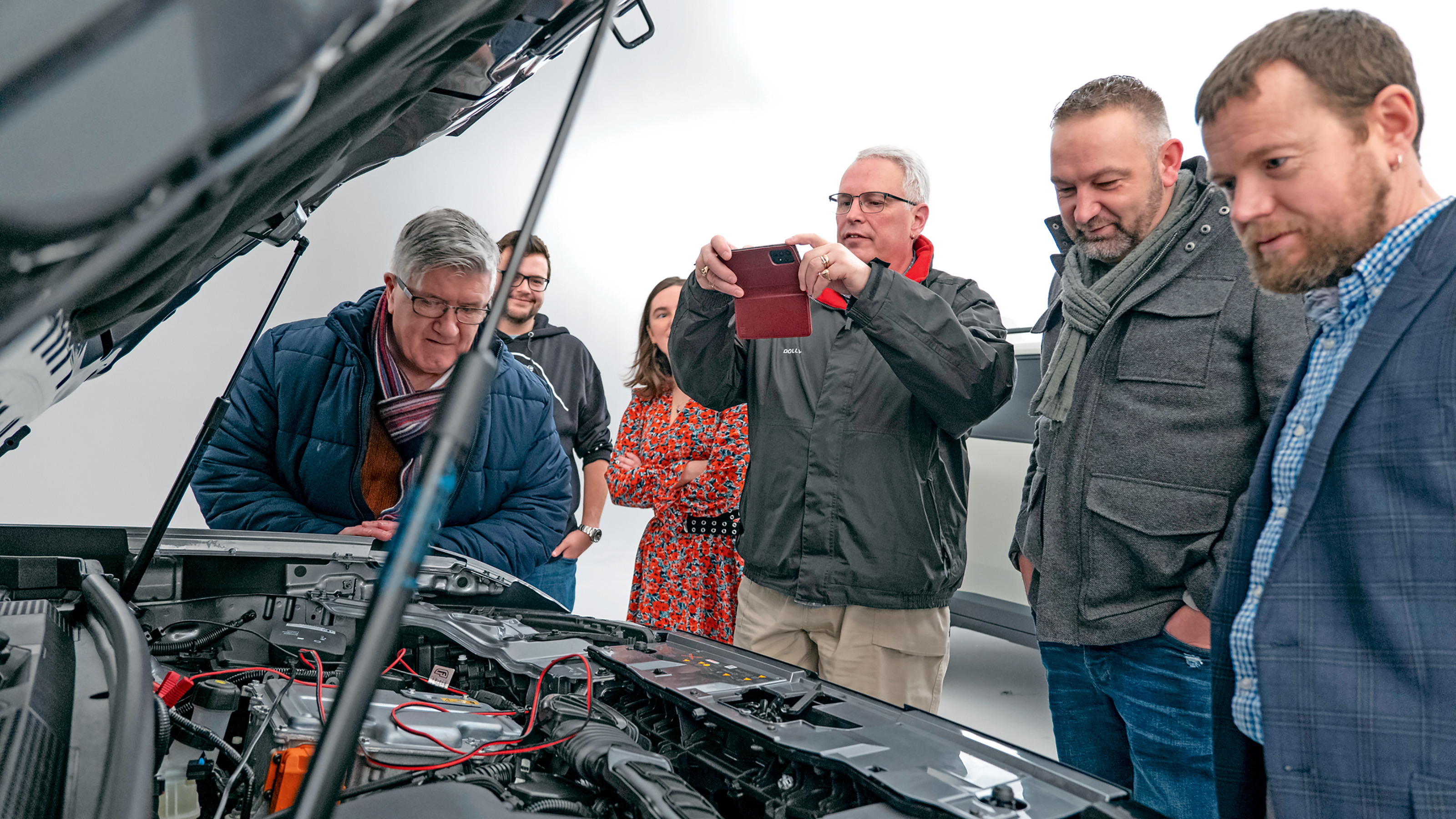 Dacia owners inspecting the Dacia Duster's engine bay
