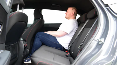 Auto Express news reporter Ellis Hyde sitting in the Hyundai Kona N Line's back seat