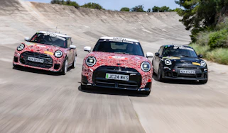 MINI Cooper JCW models on banked circuit - front action