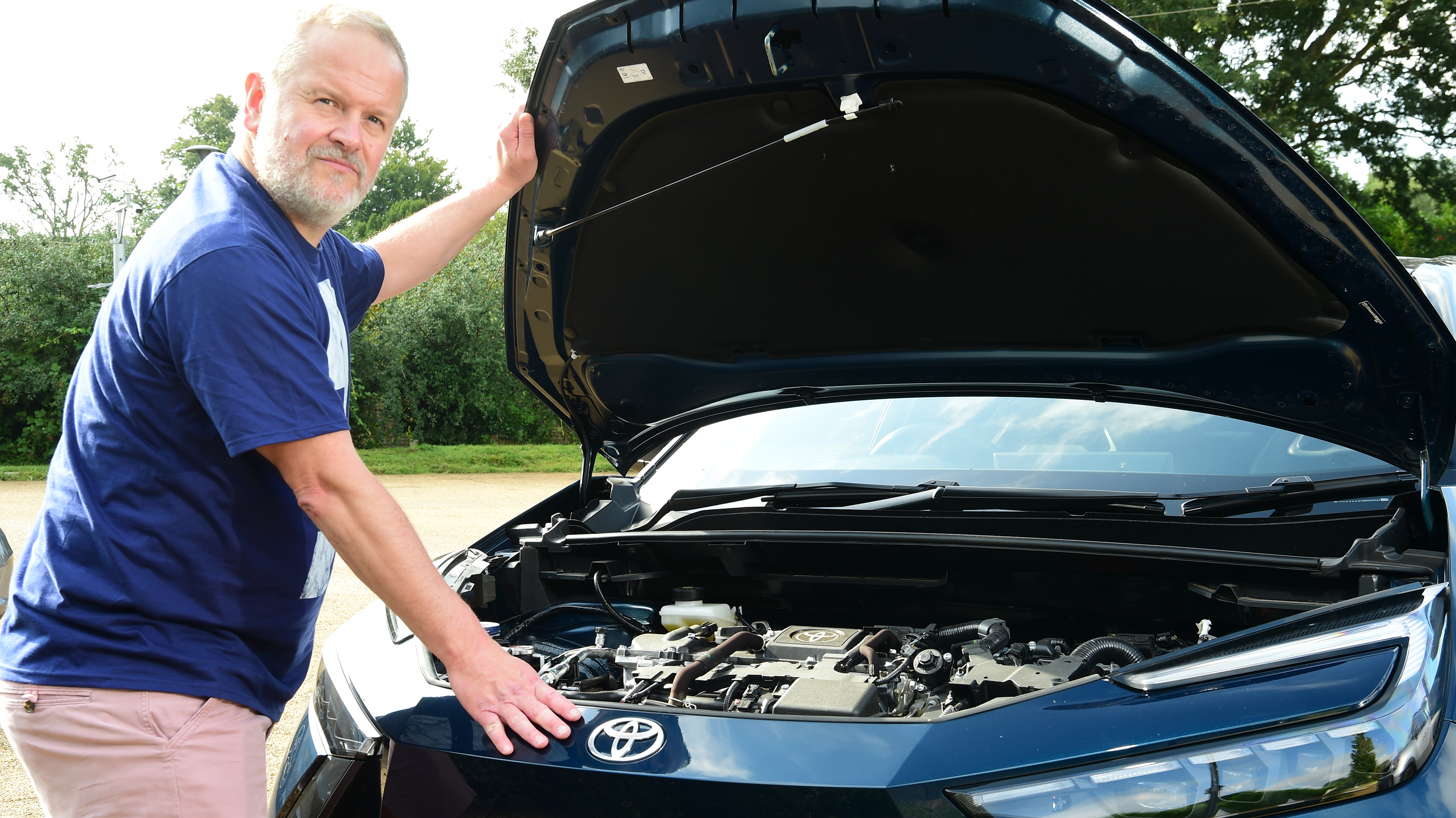 Auto Express commercial editor Paul Adam opening the Toyota C-HR's bonnet