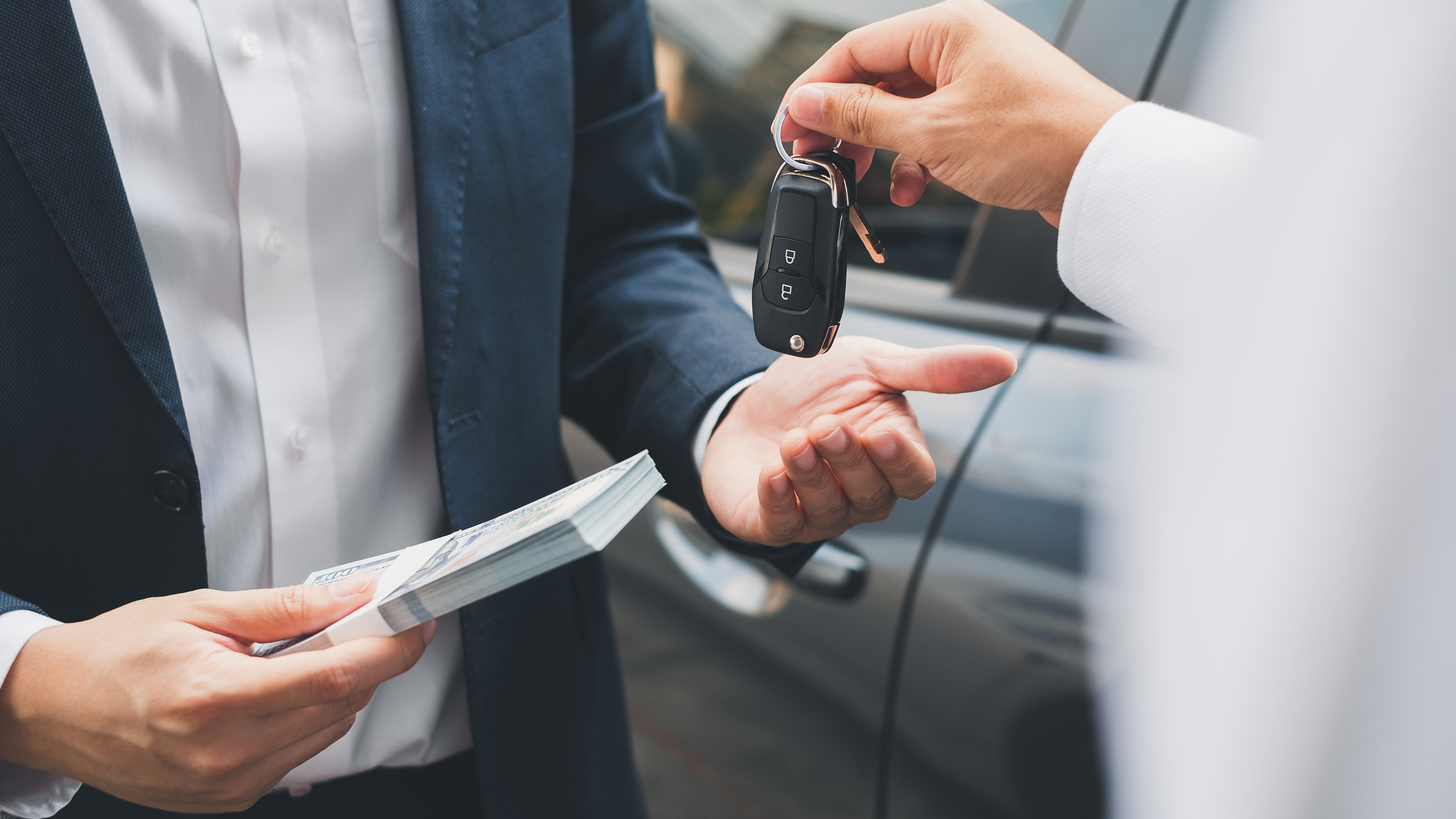 Car keys changing hands