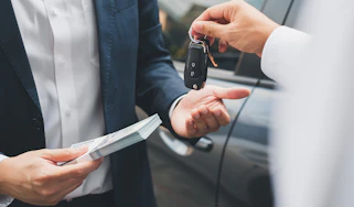 Car keys changing hands
