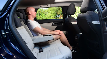 Auto Express chief reviewer Alex ingram sitting in the Citroen C5 X's back seat