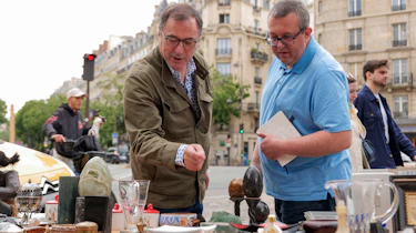 Dacia CEO Denis Le Vot and John McIlroy browsing a French market stall