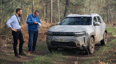 John McIlroy and Philippe Turchet inspecting the Dacia Duster