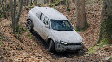 Dacia Duster descending a sharp gradient
