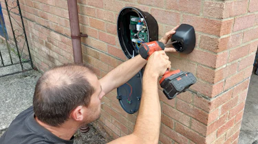 Pod Point technician installing a Pod Point SOLO S3 wallbox charger