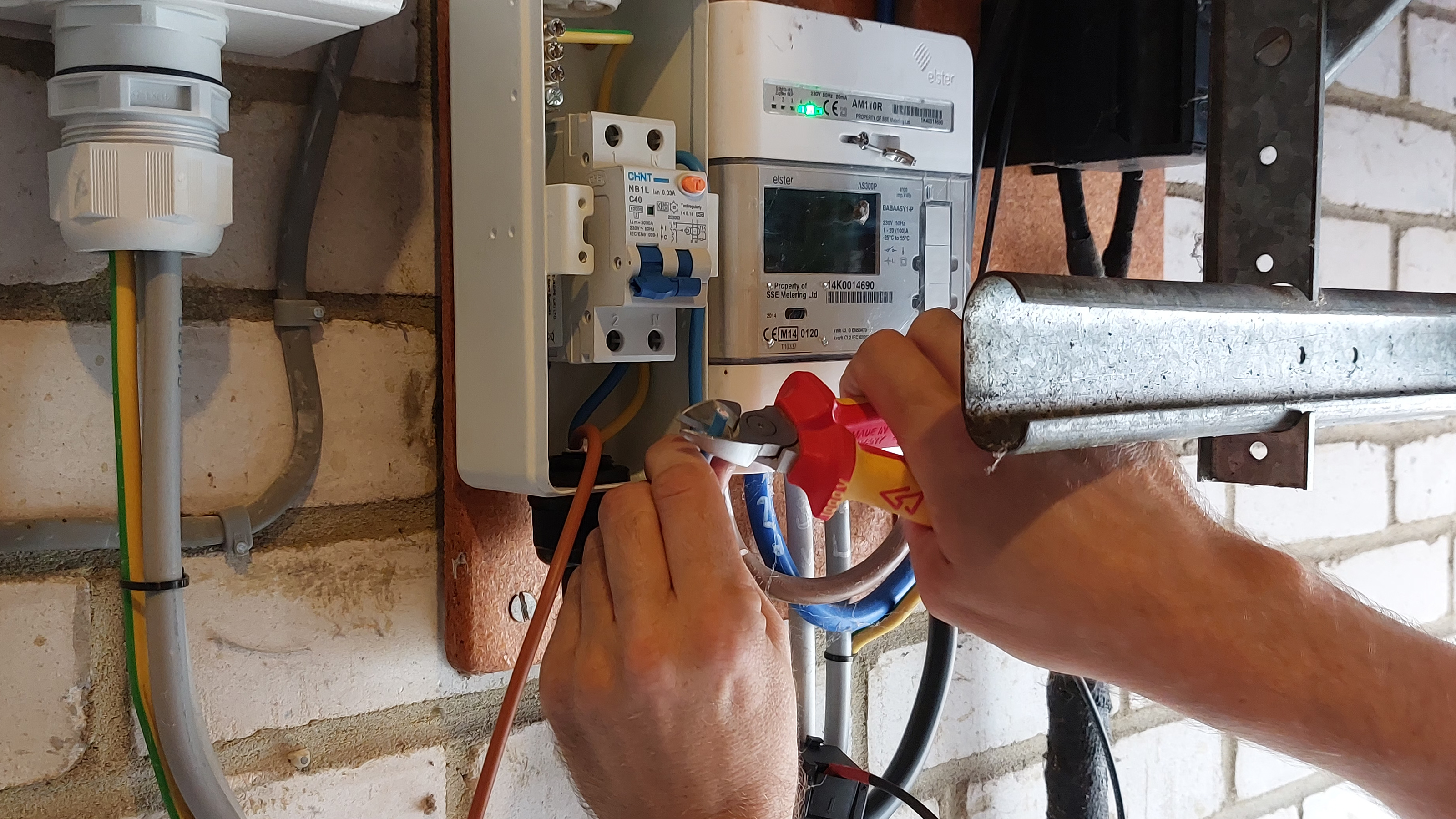 Pod Point technician installing electrical wiring