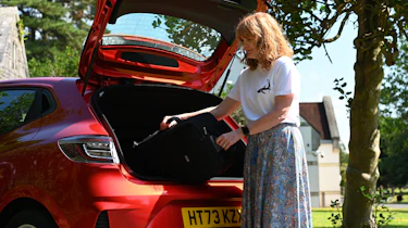 Auto Express pictures editor Dawn Grant loading the Renault Clio's boot