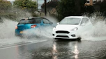 DS 3 and Ford Fiesta driving through a flood