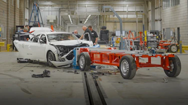 Crash tested Honda Civic being inspected by Horiba Mira technicians