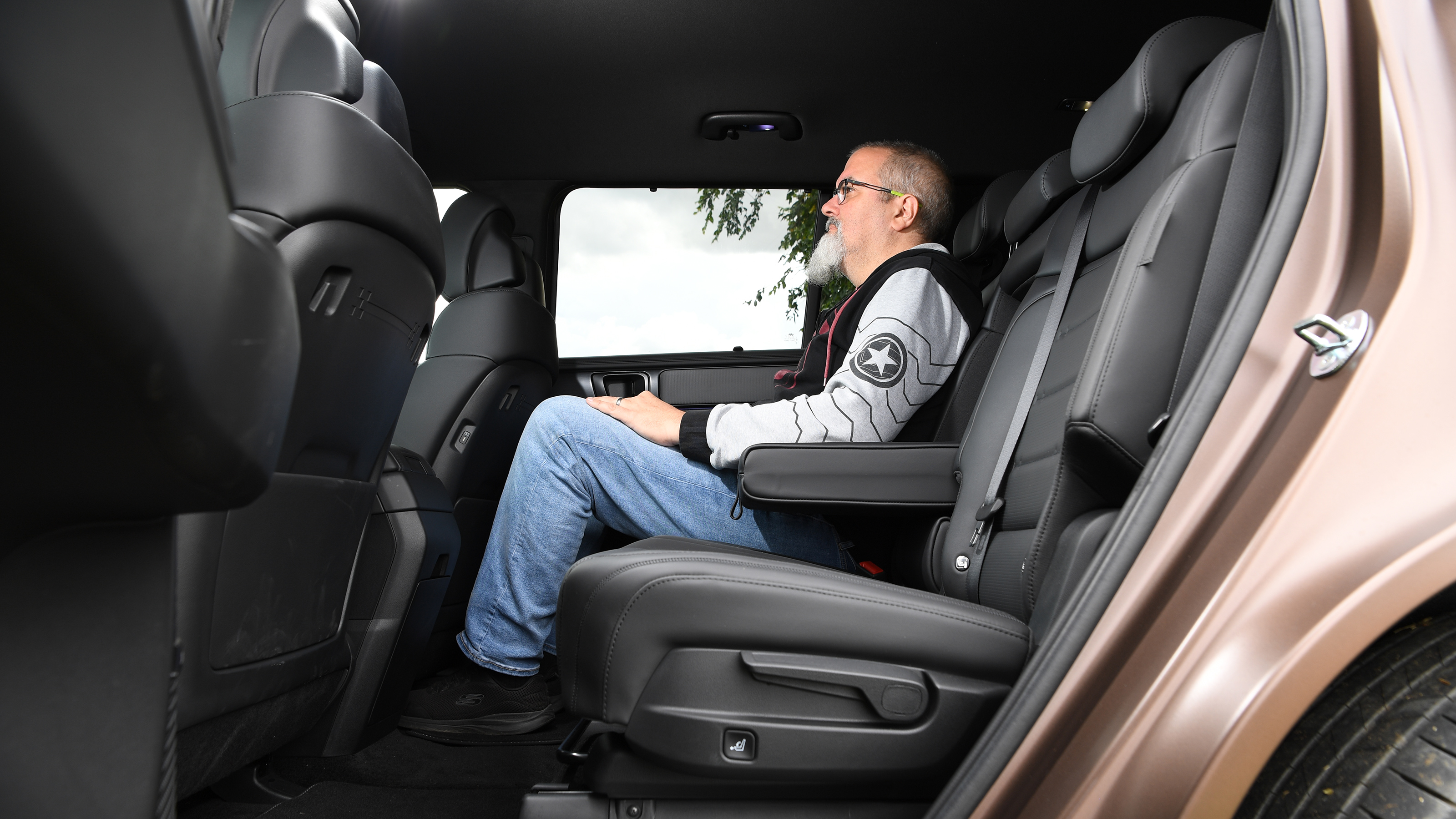 Auto Express senior test editor Dean Gibson sitting in the Hyundai Santa Fe's middle row seats