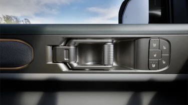 Kia Tasman - door pull and heated seat buttons
