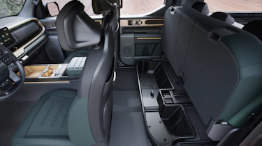 Kia Tasman - rear seat storage