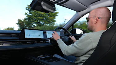 Auto Express chief reviewer Alex Ingram driving the Omoda E5
