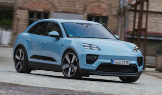 Porsche Macan Electric - front cornering in town