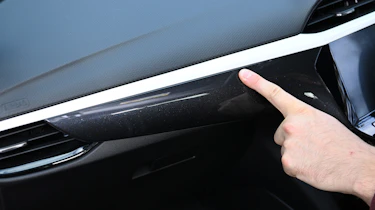 Auto Express senior news reporter Alastair Crooks touching the Vauxhall Corsa's dashboard