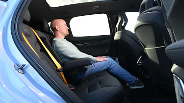 Polestar 3 - rear seats being sat in by Auto Express chief reviewer Alex Ingram