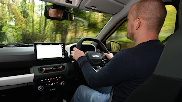 Alex Ingram driving the Dacia Spring Extreme 65