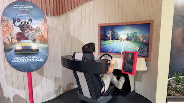 Auto Express consumer reporter Tom Jervis using a Volvo driving simulator