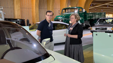 Auto Express consumer reporter Tom Jervis talking to a member of staff at the World of Volvo museum