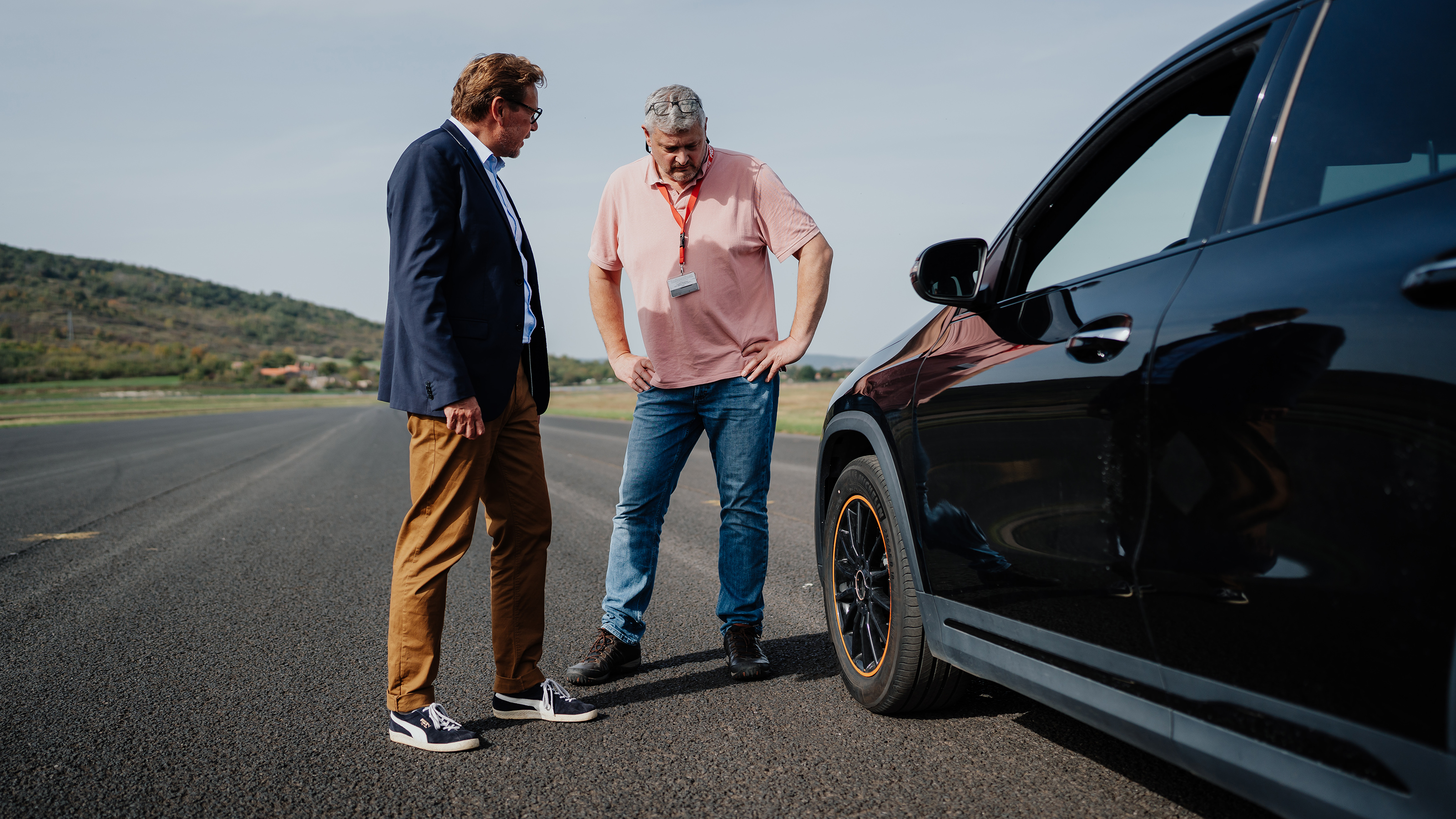 Auto Express consumer editor Chris Rosamond inspecting a car's tyre
