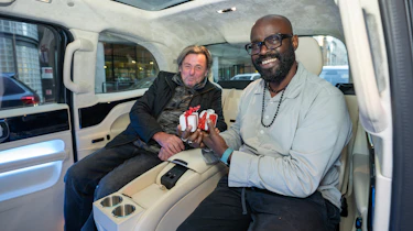 Auto Express chief columnist Mike Rutherford and Johnny H sitting in the Clive Sutton LEVC TX's back seats
