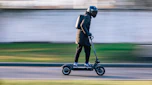 e-scooter ride moving side view