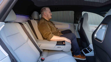 Polestar 4 Coupe - News reporter Ellis Hyde sitting in the rear seats, arm rest down