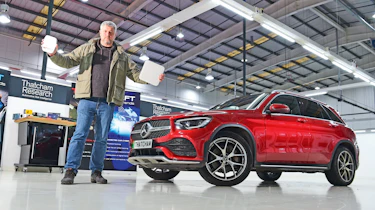 Auto Express consumer editor Chris Rosamond holding Thatcham testing equipment
