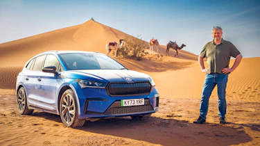 Auto Express consumer editor Chris Rosamond standing next to a Skoda Enyaq